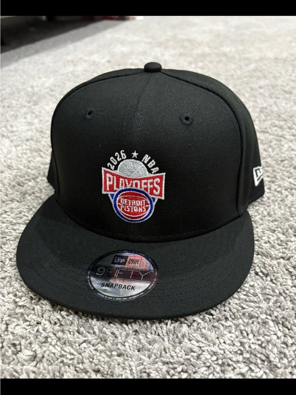 New Era Black Detroit Pistons Playoffs Snapback Hat with Red & Blue Logo